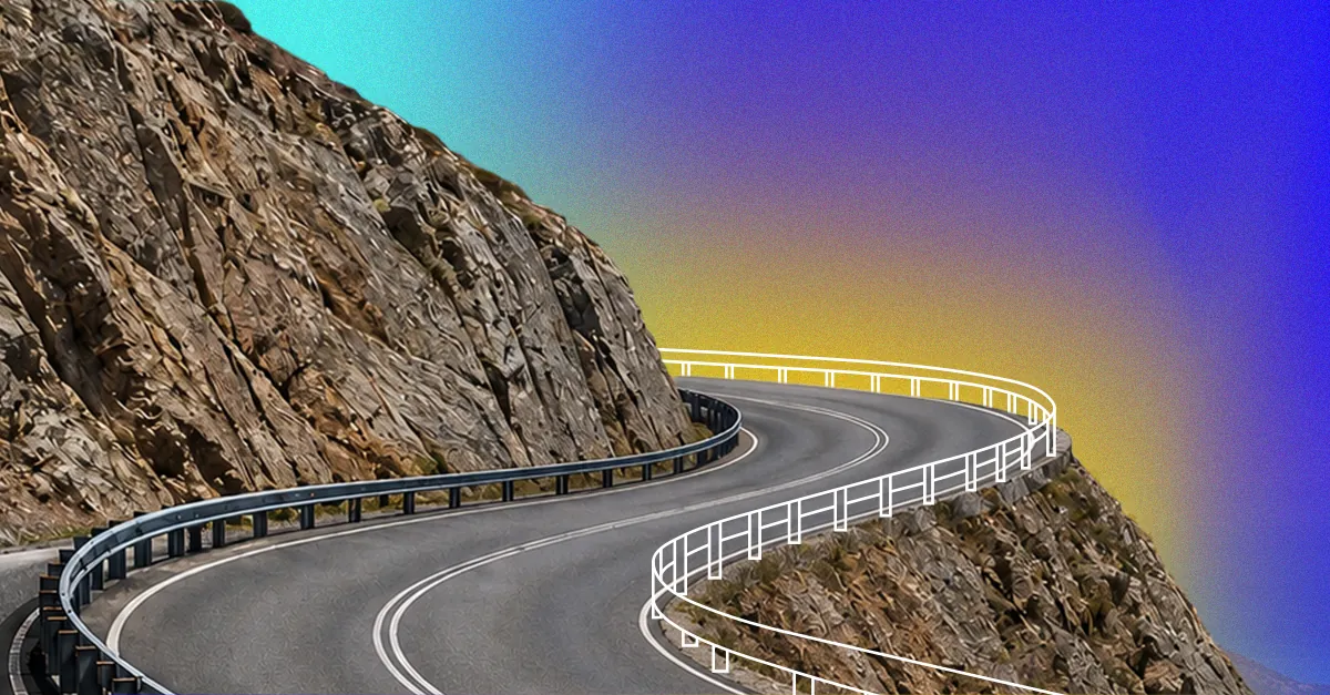 Winding mountain road curving around rocky cliffs with a vibrant gradient sky background.