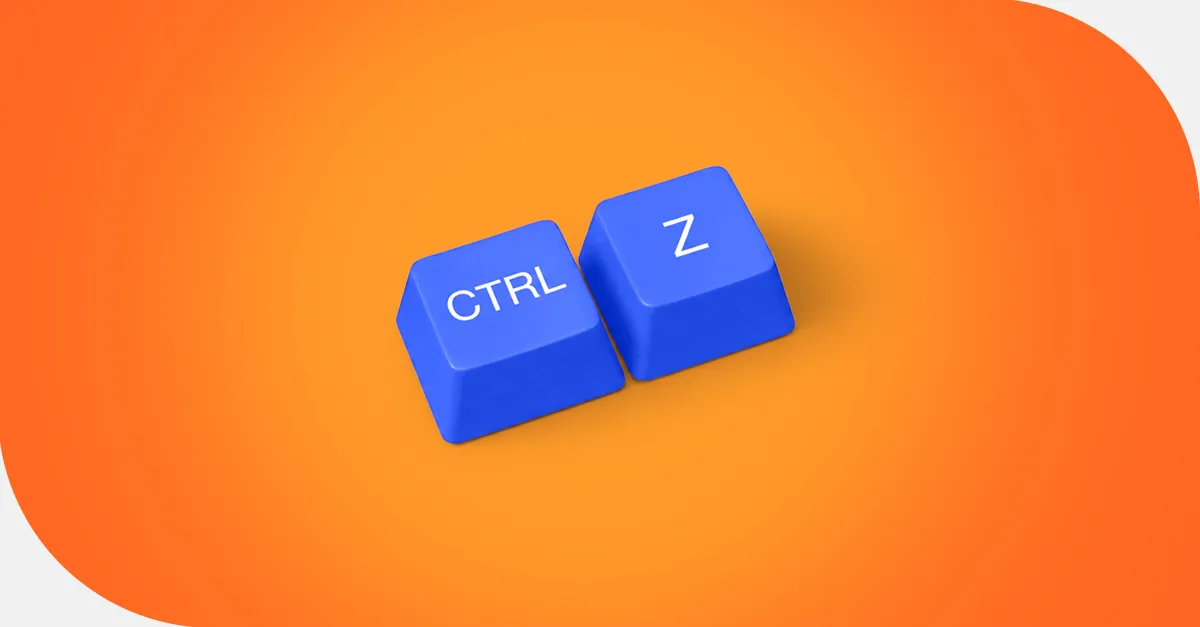 Blue computer keyboard keys CTRL and Z on a bright orange background symbolizing undo shortcut.